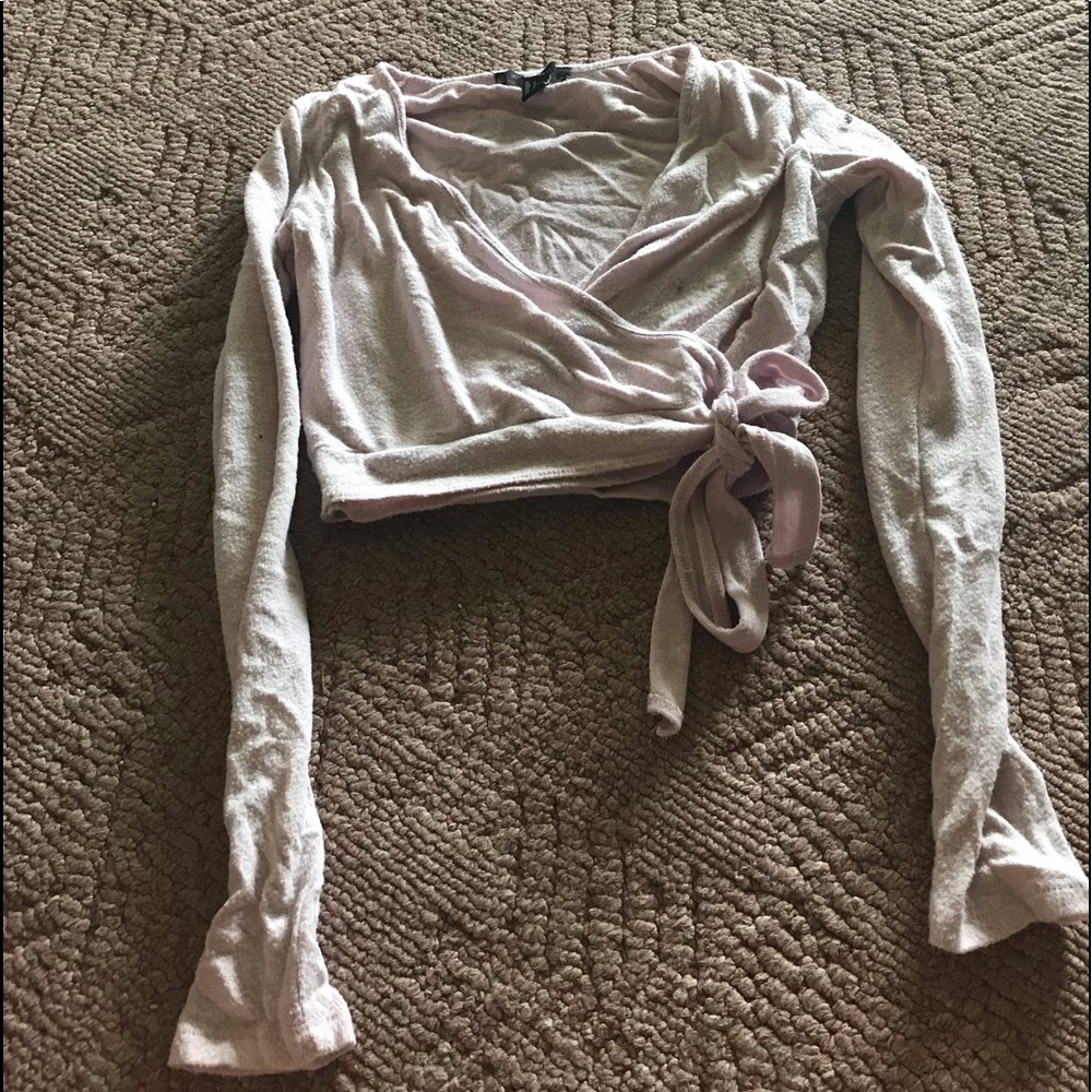 A pink long sleeve crop top
